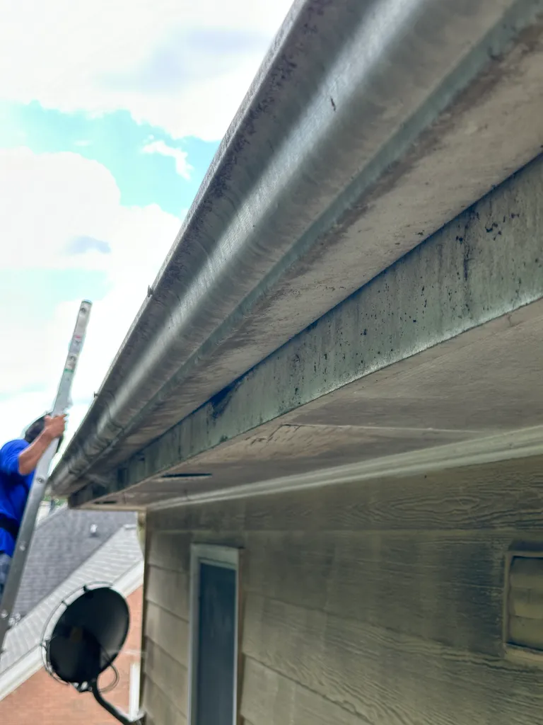 Hart Family Home Services - removing gutter to remove rotten soffit