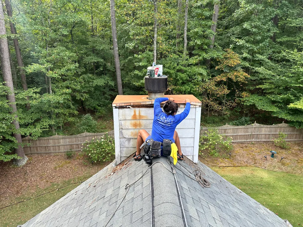 Hart Family Home Services - removing rotten trim from chimney